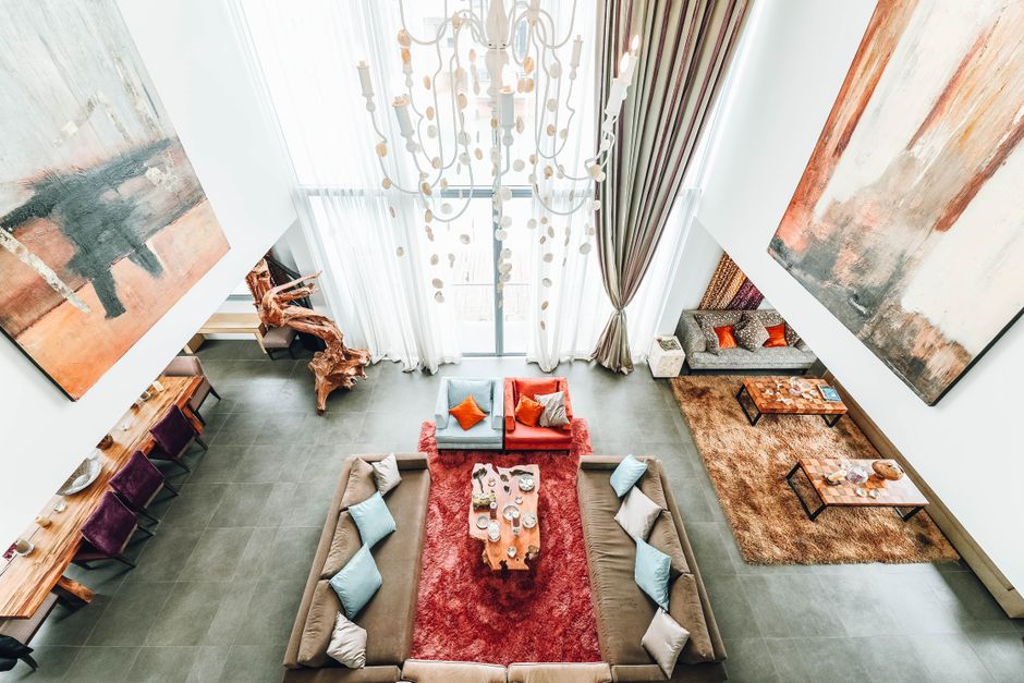 Aerial view of a luxurious modern living room with elegant furniture and artwork.